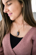 Load image into Gallery viewer, Obsidian essential oil vial necklace on model
